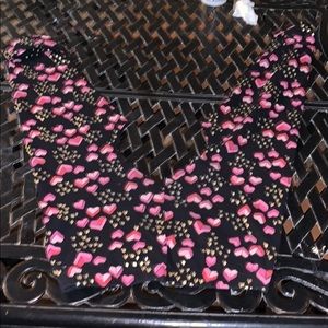 A off the shoulder cropped shirt.Heart themed top.